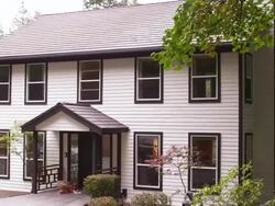 MS PAN TD Exterior of  suburban home and dog sitting on door  / Portland, Or, United States Stock Footage