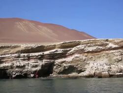 WS POV side View from boat of Paracas candelabra / Paracas, Nazca, Peru Stock Footage