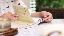 Woman Reading a Book in cafe, Reading, Lifestyle Stock Footage