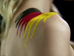Woman with German flag painted on shoulder Stock Footage