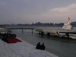 MS Pilgrims praying in front of statue of lord shiva at ganges river bank / Rishikesh, Uttarakhand, India Stock Footage