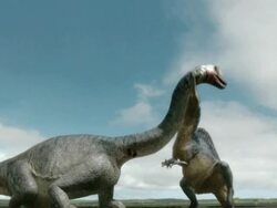 Low Angle hand-held - A dinosaur strangles a Brachiosaurus in a computer-generated animation. / Washington, DC, USA Stock Footage