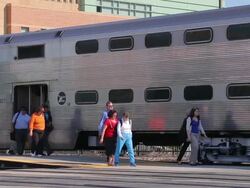 Commuters exit a train Stock Footage