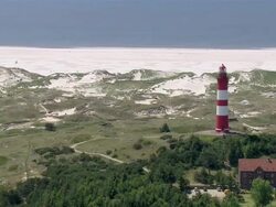 WS AERIAL View of lighthouse / FoehrAmrum, Schleswig-Holstein, Germany Stock Footage