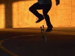 A young man skateboarding in a parking garage. - Slow Motion - filmed at 240 fps Stock Footage