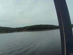 Drive across trestle bridge with large Arkansas river in background Stock Footage