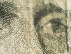 Pan to a close up of Andrew Jackson's eyes on the twenty dollar bill Stock Footage