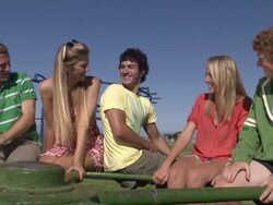 MS Five students on stationary merry go round smiling and chatting / Cape Town, Western Cape, South Africa Stock Footage