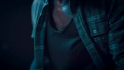 Man in motorcycle workshop grinding a piece of metal Stock Footage