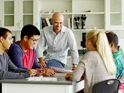 Teacher and students in classroom Stock Footage