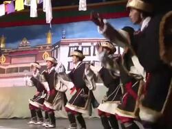 MS People lined up performing choreographed dance on stage in traditional Indian costumes AUDIO / Dharamsala, Himachal Pradesh, India Stock Footage