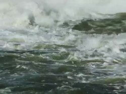 Water churns from dam spillway Stock Footage