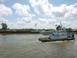MS T/S View of tugboat flowing on mississippi river / New Orleans, Louisiana, United States Stock Footage