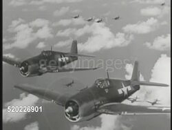 1945: WARBIRDS: AERIAL: MS Two Grumman F4F 'Wildcat' (carrier based fighters) in side by side flight w/ F4U Corsairs BG. World War II, WWII. Instructional Video