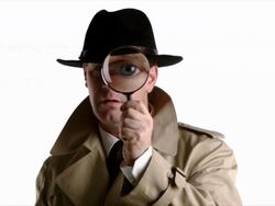 Detective looks through magnifyer Stock Footage