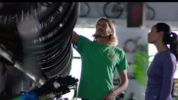 Woman asks bike shop employee for assistance and listens to his advice Stock Footage