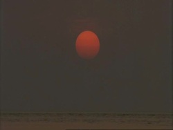 MS Dusk sun low over sea, Sunderbans, India Stock Footage
