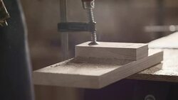 Hole and sawdust on a wood plank Stock Footage