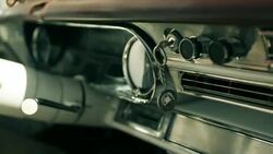 Las Vegas keychain dangles from ignition in classic convertible Stock Footage