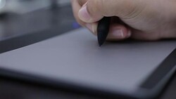 Woman drawing on mouse pad Stock Footage