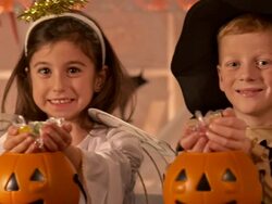 HD DOLLY: Children Holding Out Halloween Candy Stock Footage