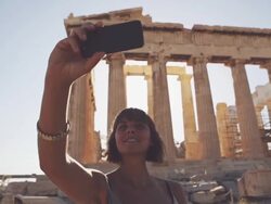 Woman taking a selfie in front of Parthenon Stock Footage