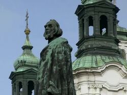MS View of hus monument behind church st. nicolas / Prague, Hlavni mesto Praha, Czech Republic Stock Footage