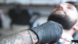 brutal barber clipper mows bearded hipster Stock Footage