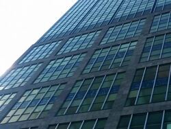 Skyscraper with sunshine and zoom Stock Footage