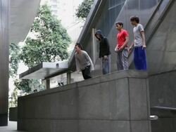 WS Four young men doing somersault off wall Parkour/Singapore Stock Footage