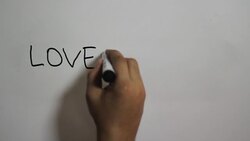 Hand writing a 'Love is rare' message on a white board using a black marker Stock Footage