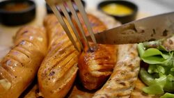 Grilled sausage for dinner Stock Footage