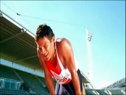 MS exhausted runner recovering on track, Australia Stock Footage