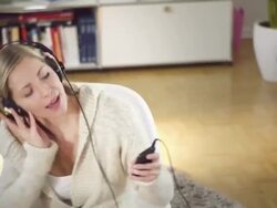 Woman listening music Stock Footage