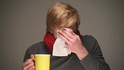 sick young man sneezes Stock Footage