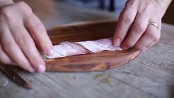 Woman rolling asparagus in bacon Stock Footage