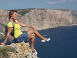 young woman traveling on the mountain coast Stock Footage