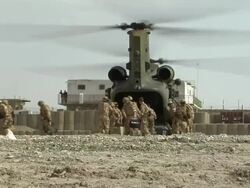 WS Soldiers loading luggage in military Helicopter / Musa Qala, Helmand Province, Afghanistan. Stock Footage