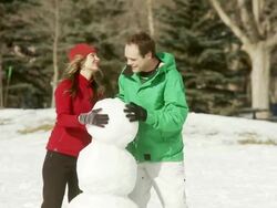 Family builds a snowman Stock Footage