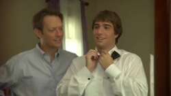 CU, Father tying teenage boy's (16-17) bowtie in front of mirror, Edison, New Jersey, USA Stock Footage