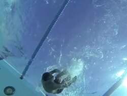 MS PAN SLO MO Shot of male, baby boomer, swimmer performs flip turn in underwater / Davis, California, United States  Stock Footage