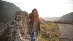 Traveler with backpack walking in mountains Stock Footage