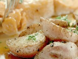 ECU fork lifts a piece from salmon steak and pokes into fried potato Stock Footage