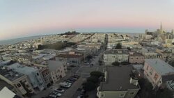San Francisco Financial District photographed from the tallest building at the top of Russian Hill in San Francisco.  As lights of office towers remain lighted, the sky passes from daylight to twilight Stock Footage