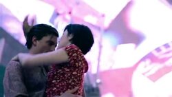 Young couple dance together closely under the colorful lights in downtown Las Vegas Stock Footage