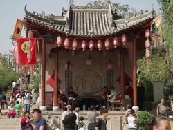 Old man performing traditional opera in folk customs village during holidays in Xingping, Shaanxi, China Stock Footage