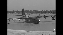 US Navy flying boat 'Hawaii Mars' taking off from Baltimore harbor during World War II News Clip