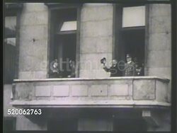 1941: BERLIN, GERMANY: ** XWS Yosuke Matsuoka & Adolf Hitler appearing on balcony. MS Matsuoka saluting w/ hat, Hitler next to him BG. VS Crowds of Germans cheering. MS Matsuoka & Hitler standing on balcony together, Hitler giving Nazi salute. WWII Instructional Video