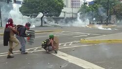 CLEAN : Anti-riot police stop protesters with tear gas in Caracas News Clip