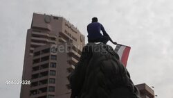 Cairo Protests - Protester Waving Egyptian Flag News Clip